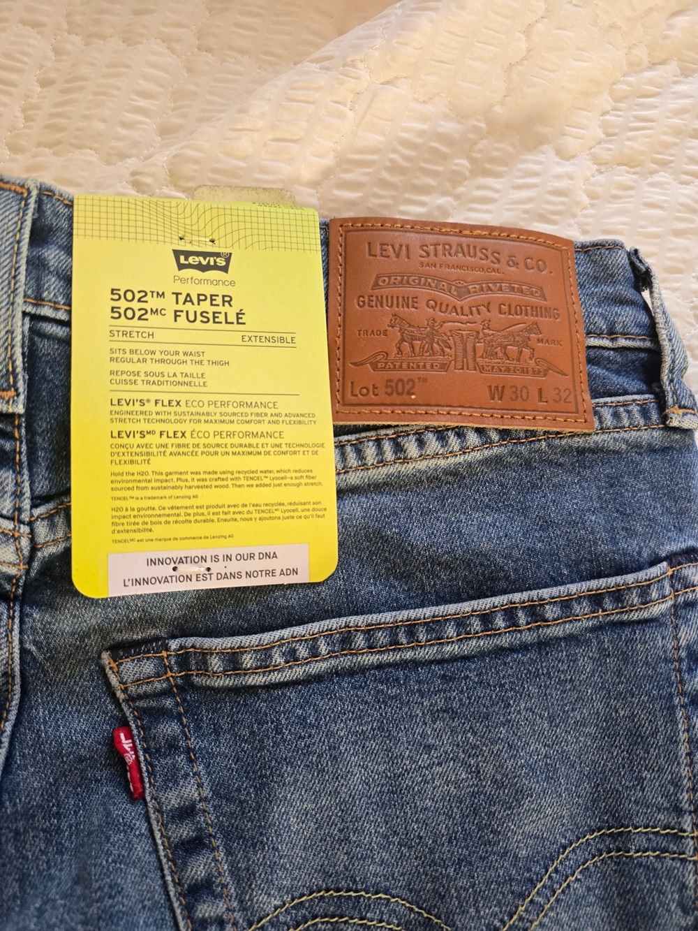 Levi's 502 Taper Slim Jeans in Blue Denim with Brown Leather Patch